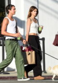 Kaia Gerber opts for a casual look in a tank top and sweatpants while running errands with a friend in Los Feliz, California