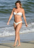 Kristin Cavallari looks incredible in a white bikini as she takes a dip in the ocean while on vacation in Los Cabos, Mexico