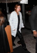 Bella Thorne rocks a light blue tweed coat with black leather pants during a night out at Delilah in West Hollywood, California