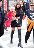 Emily Ratajkowski looks stylish in a black mini dress while heading to the Halloween Parade with her son in New York City