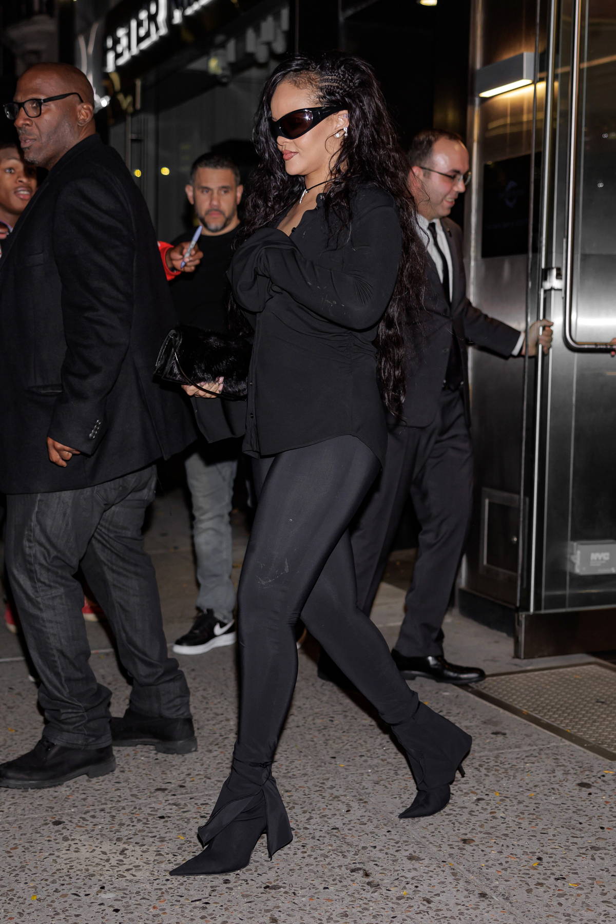 rihanna looks stunning a black shirt with matching leggings and