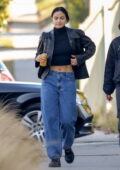 Camila Mendes flashes her flat abs in a black crop top and leather jacket while heading to a photoshoot in Los Angeles