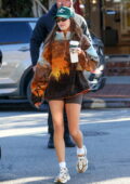 Hailey Bieber displays her slender legs in spandex shorts while out for lunch with friends in West Hollywood, California