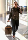 Hayden Panettiere is all smiles as she and Brian Hickerson are seen arriving minutes apart at LAX in Los Angeles