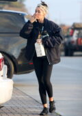 Miley Cyrus wears a black jacket and leggings while out for some grocery shopping in Malibu, California