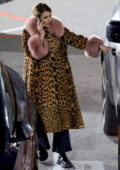 Emma Roberts bundles up in a fur-lined animal print coat as she leaves the Salty Girl with her mom in West Hollywood, California