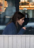 Kaia Gerber steps out in the rain to grab lunch with her BFF Travis Jackson at Erewhon in Los Angeles