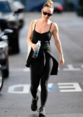Olivia Wilde shows off her athletic body in a black top and leggings while leaving the gym in Studio City, California