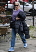 Gemma Atkinson hides her growing baby bump with her coat as she arrives at Hits Radio Station in Manchester, UK