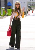 Heidi Klum dons a stylish sweater and black trousers as she arrives AGT Studios in Pasadena, California