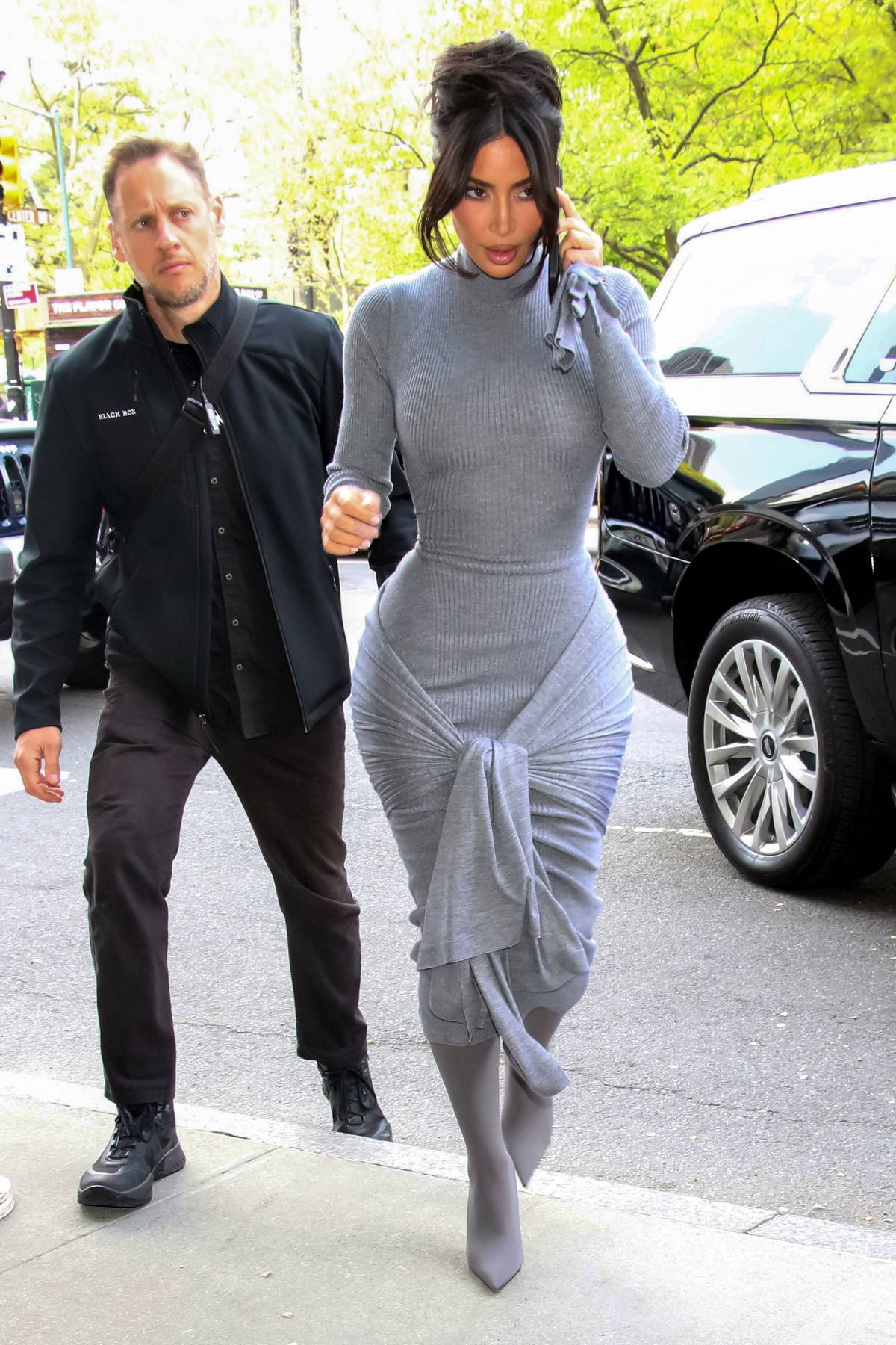 Kim Kardashian displays her famous curves in a grey body-hugging dress while  visiting an office building in New York City-260423_16