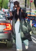 Lily James spotted in a leather trench coat and jeans while in New York City