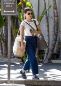 Lucy Hale wears a white top and blue jeans during a shopping trip in Los Angeles