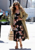 Sofia Vergara looks good in a floral print dress and a trench coat as she arrives at the AGT Studios in Pasadena, California