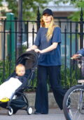 Jennifer Lawrence keeps a low profile while out for a stroll with her son before running errands in New York City