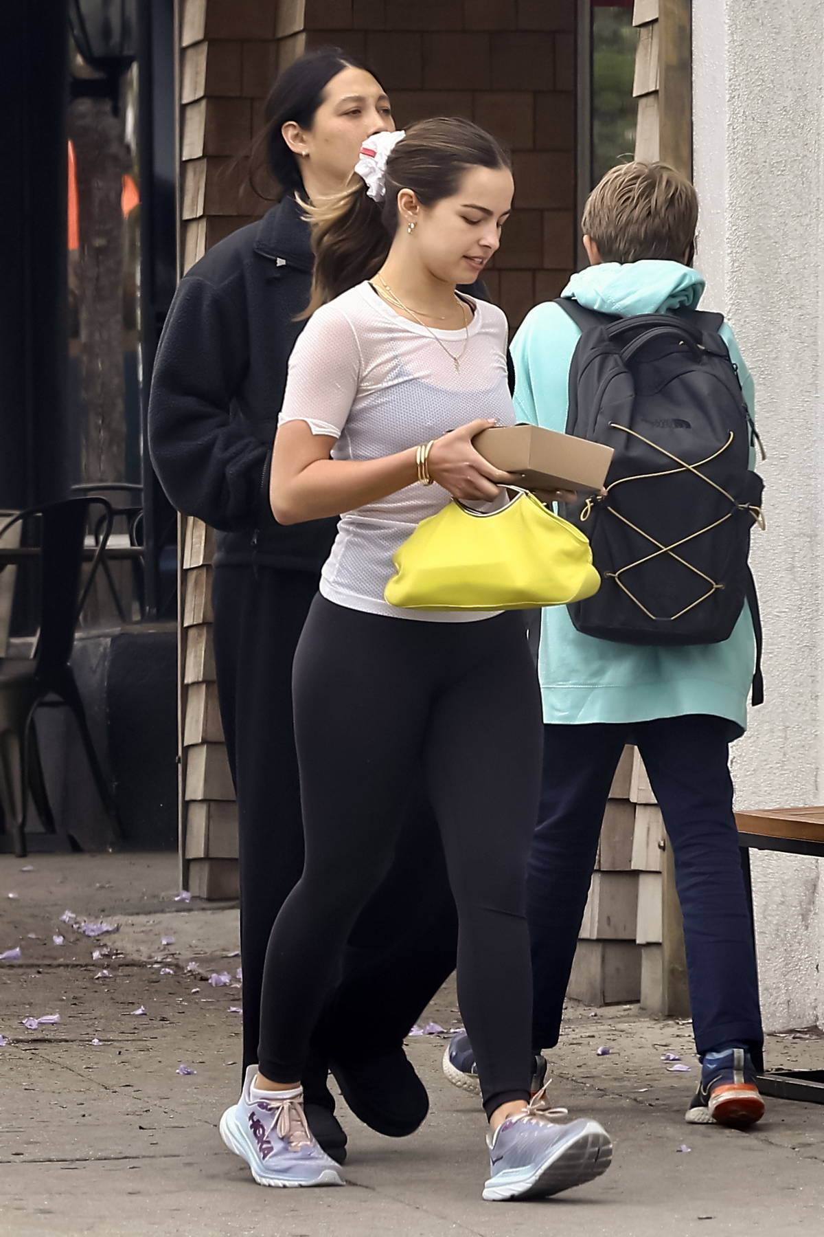 https://www.celebsfirst.com/wp-content/uploads/2023/06/Addison-Rae-sports-a-semi-sheer-white-top-and-black-leggings-while-she-grabs-lunch-with-a-friend-at-All-Time-Restaurant-in-Los-Angeles-070623_11.jpg