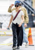 Elizabeth Olsen wears a white shirt and black trousers while stepping out for coffee with husband Robbie Arnett in New York City