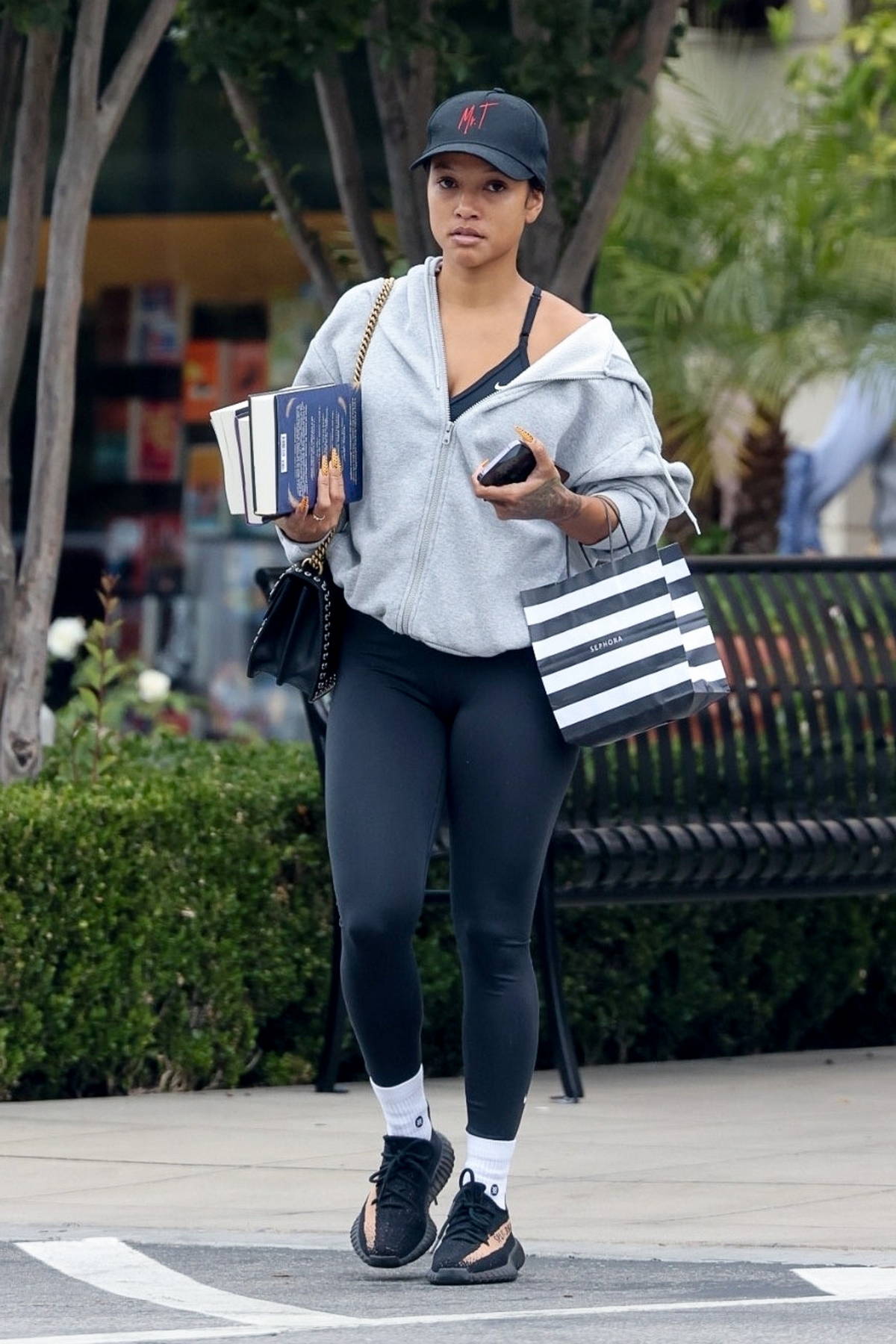 Karrueche Tran dons a grey hoodie and black leggings during a shopping trip  in Calabasas, California