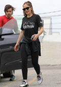 Minka Kelly sports a black tee and leggings as she leaves after a workout session at a gym in Beverly Hills, California