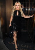 Tallia Storm looks great in a black dress as she leaves her hotel in Central London, UK