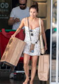 Eva Longoria goes makeup free in a white mini dress while shopping for household items for her new home in Marbella, Spain