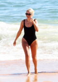 Holly Willoughby looks great in a black swimsuit as she hits the beach in Algarve, Portugal