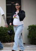 Kourtney Kardashian shows her baby bump while stepping out for a date night with Travis Barker in Los Angeles