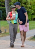 Paris Hilton and husband Carter Reum get all loved-up while enjoying a romantic beach walk in Maui, Hawaii