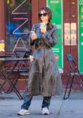 Emily Ratajkowski rocks a leather trench coat and leather pants while she walks her dog and grabs coffee in New York City