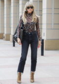 Heidi Klum rocks animal print top with matching boots while arriving at America's Got Talent studios in Pasadena, California