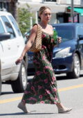 Hilary Duff looks lovely in a floral print summer dress as she steps out for lunch in Los Angeles