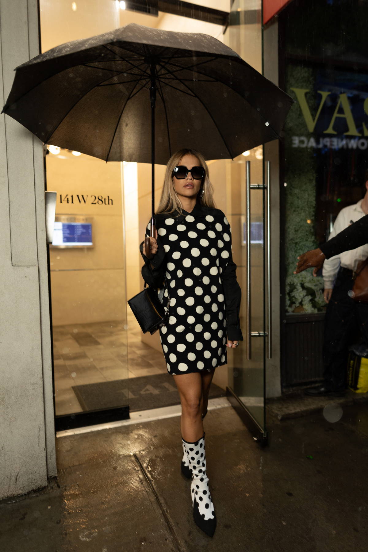 Rita Ora looks fashionable in a polka dot dress with matching shoes as she  leaves a photo studio in New York City