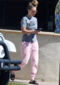 Kaley Cuoco looks casual in a Nike tee and pink sweatpants while running errands in Westlake Village, California