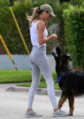 Gisele Bundchen shows off her fit physique in a tank top and leggings while playing with her German Shepherd in Surfside, Florida