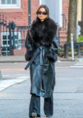 Emily Ratajkowski looks stylish in a fur-lined leather trench coat while out on a stroll in New York City