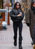 Kendall Jenner rocks a black leather jacket paired with matching leggings, boots and ear muffs while stepping out in Aspen, Colorado
