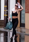 Olivia Wilde displays her incredible physique in a black sports bra and leggings while leaving the gym on a rainy day in Studio City, California