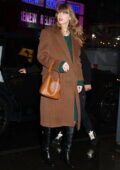 Taylor Swift looks stylish in a tan coat and green dress while heading into Electric Lady Studio in New York City