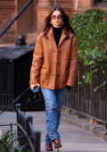 Emily Ratajkowski rocks a burnt-orange leather jacket with matching boots while out for a dog walk in New York City