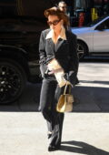 Rita Ora looks stylish in a black corduroy suit while stepping out in New York City