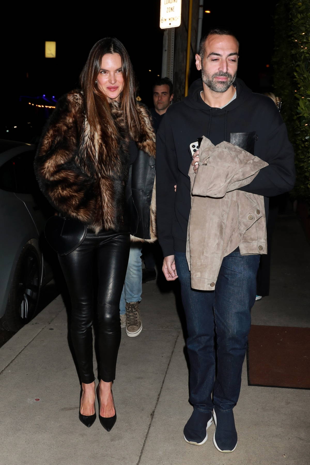Alessandra Ambrosio looks fabulous in a fur coat with black leather pants during a night out with Mohammed Al Turki in Santa Monica, California