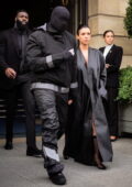 Bianca Censori covers up in a floor-length leather coat while spotted outside the Ritz Paris with Kanye West in Paris, France