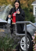 Amelia Hamlin is all smiles during FaceTime conversation with a friend while waiting at a nail salon in Santa Monica, California