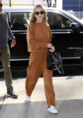 Emily Blunt looks radiant in a bronze sweatsuit while spotted outside 'The Drew Barrymore show' studios in New York City