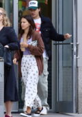 Millie Bobby Brown wears a brown sweater with a purple top during a coffee run with Jake Bongiovi in New York City