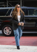 Jessica Alba looks great in a black blazer, black boots, baggy blue jeans and Valentino bag while stepping out in New York City