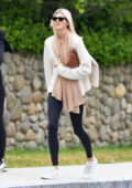 Devon Windsor dons a cream sweater and black leggings while out in Westerly, Rhode Island