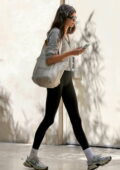 Kaia Gerber displays her mile-long legs in black leggings while heading of a workout session in Los Angeles