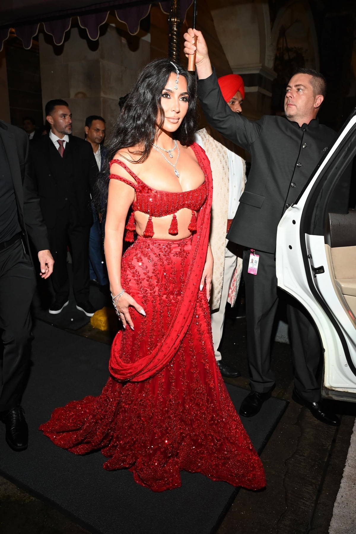 Kim Kardashian looks gorgeous in a red outfit while attending Anant Ambani's wedding in Mumbai, India