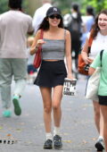 Olivia Rodrigo looks cute in a striped tank top and mini skirt while grabs a cookie and matcha with a friend in New York City